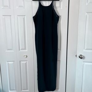 Elegant Black Floor Length Dress With Beaded Neckline and Back Detail